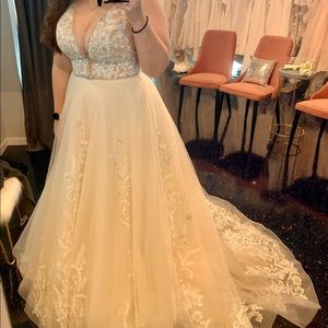 Never worn designer wedding dress